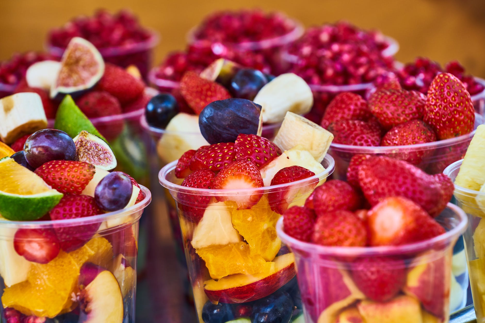 assorted fruits on disposable plastic cups