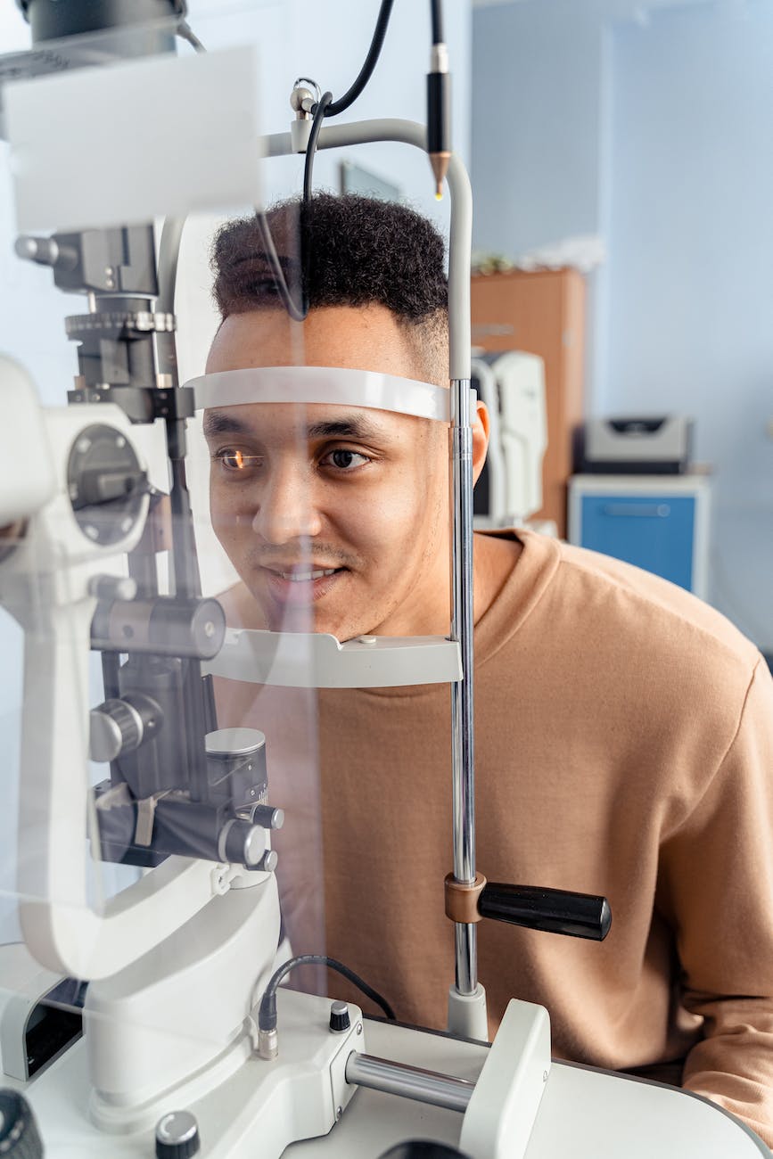 man in brown crew neck shirt in optical check up
