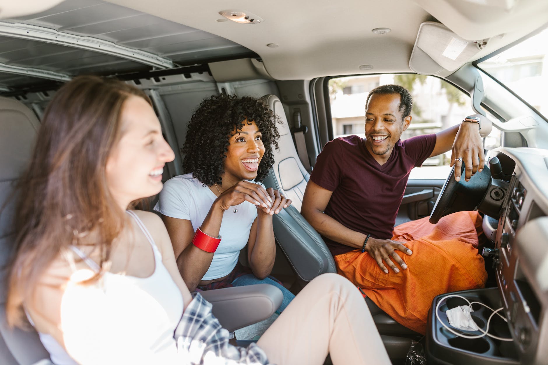 close up shot of friends riding a car