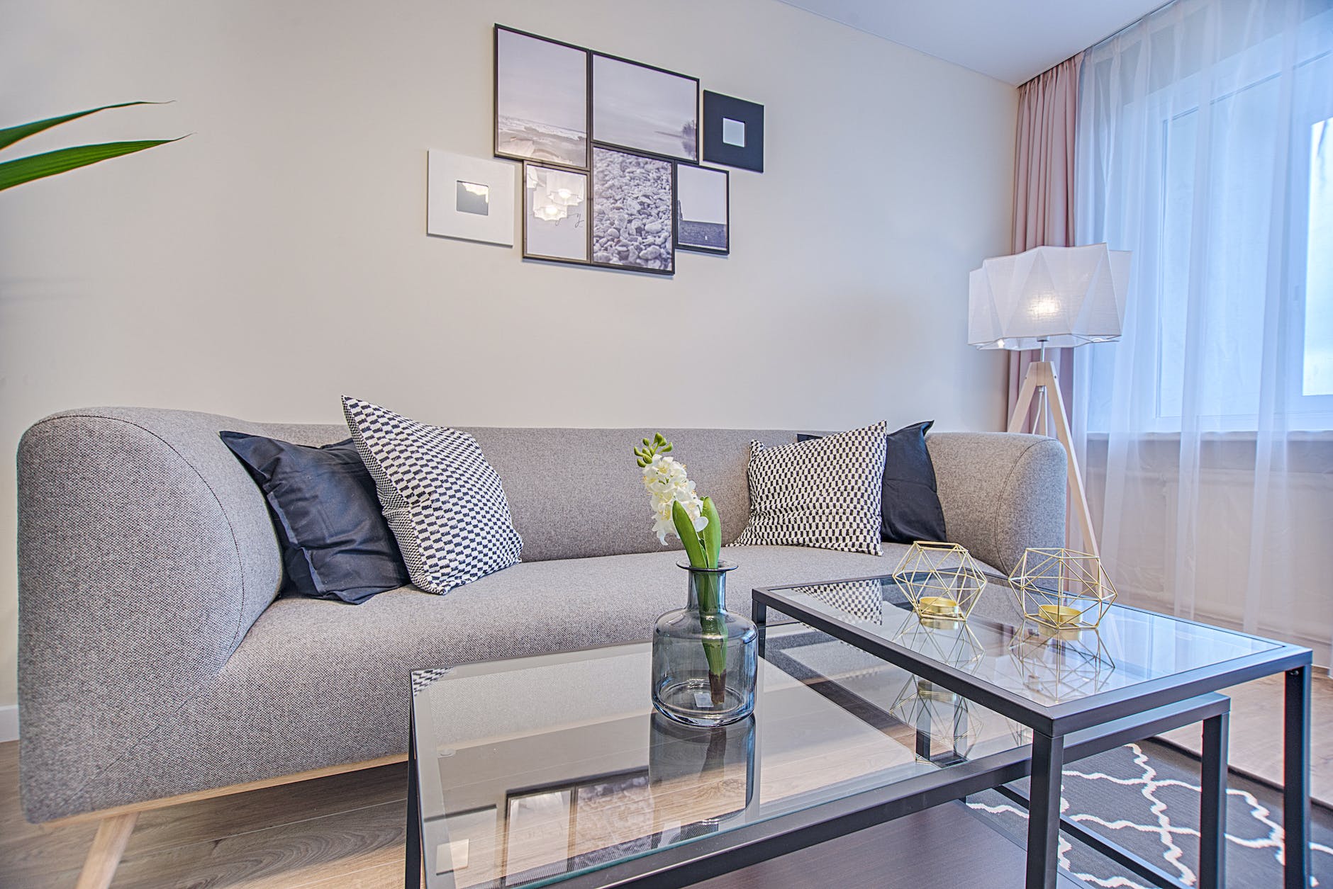 floor lamp beside sofa and window